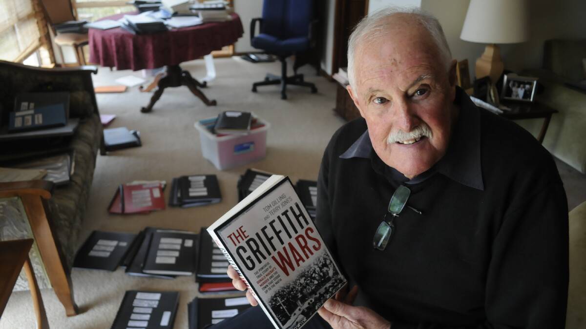 NEW CHAPTER: Former Western Advocate journalist Terry Jones with his book The Griffith Wars, which he says will shock readers. It will hit the shelves on September 27. Photo: CHRIS SEABROOK