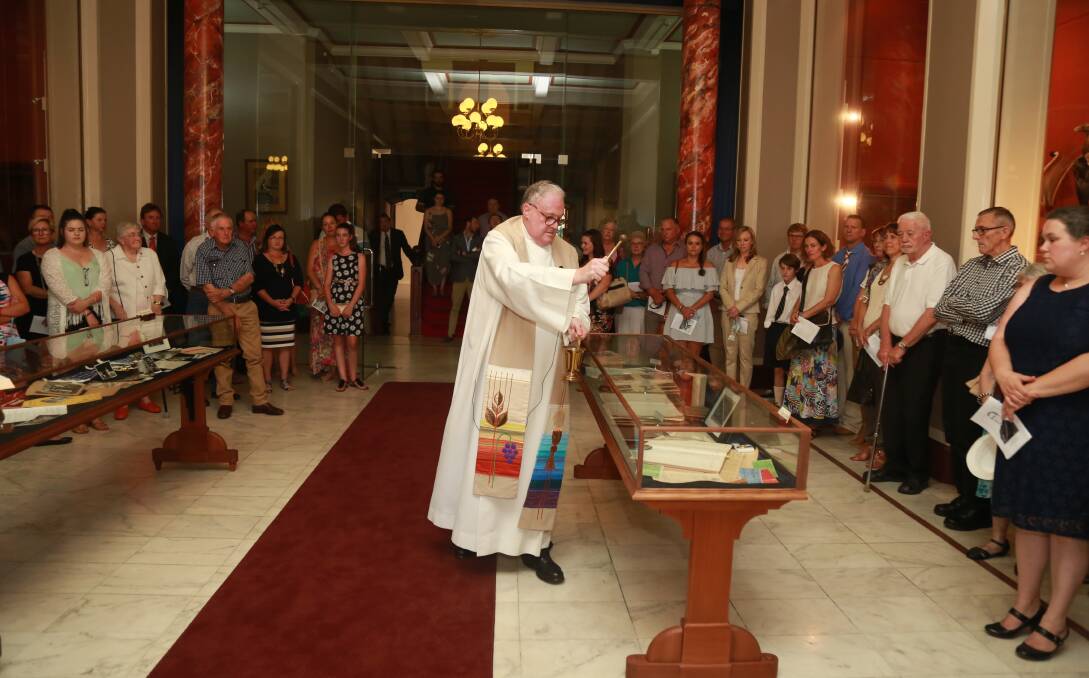 SESQUICENTENARY: Father Gregory Brett CM, blesses St Stanislaus' College Sesquicentenary Historic Display, in the Marble Hall.
