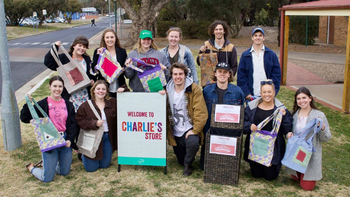 FIGHTING AGAINST WASTE: Students from Charles Sturt University with their recycable bags.