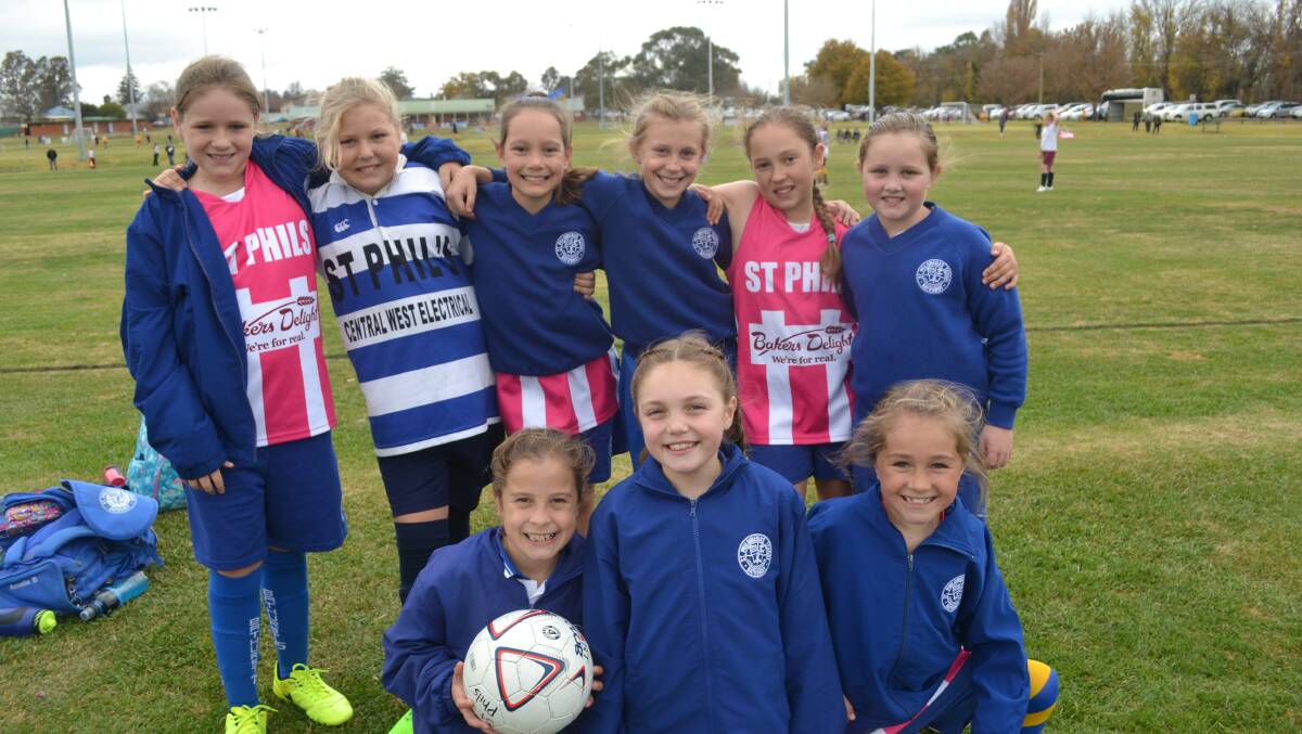ST PHIL'S: Students from St Phil's in Bathurst taking a break in between games at the Gala Soccer Day.