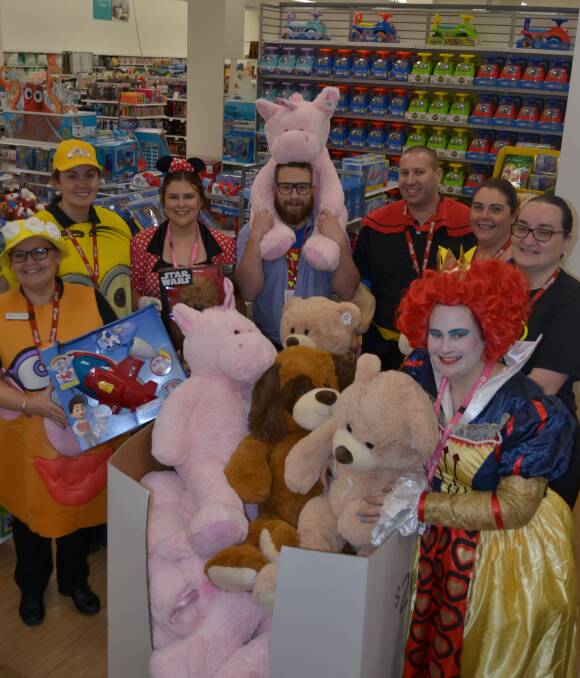 WHAT'S BIG THIS CHRISTMAS?: Kim Touzell, Sarah Murphy, Alisha Garlick, Matt Stoffels, Gavin Pears, store manager Lisa Morrison, Heather Currie and Kiri Allen with some of the toys which will be popular this Christmas.