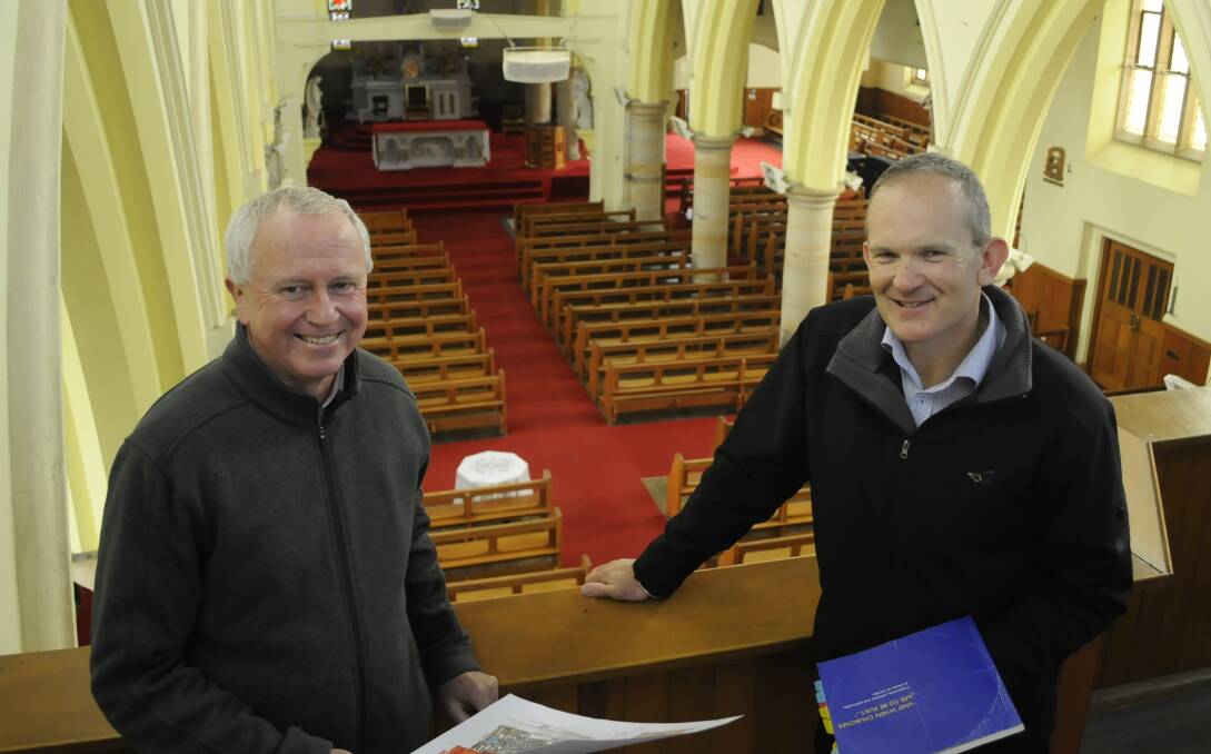COMMUNITY CONSULTATION: Phil Burgett with David Nelson inside the Cathedral of St Michael and St John. Photo: CHRIS SEABROOK 101216cathd1