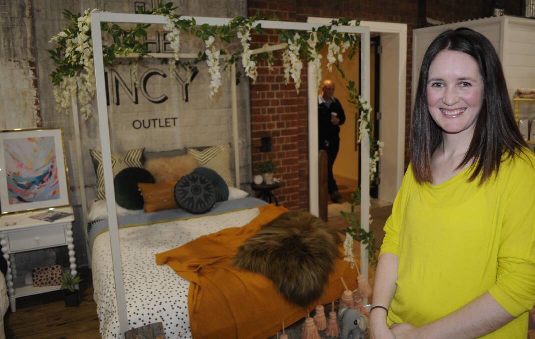 ALL STYLED UP: Entrant, Gabrielle Logan with her finished styled bed behind her, which was done as part of the challenge. 091716cbeds8