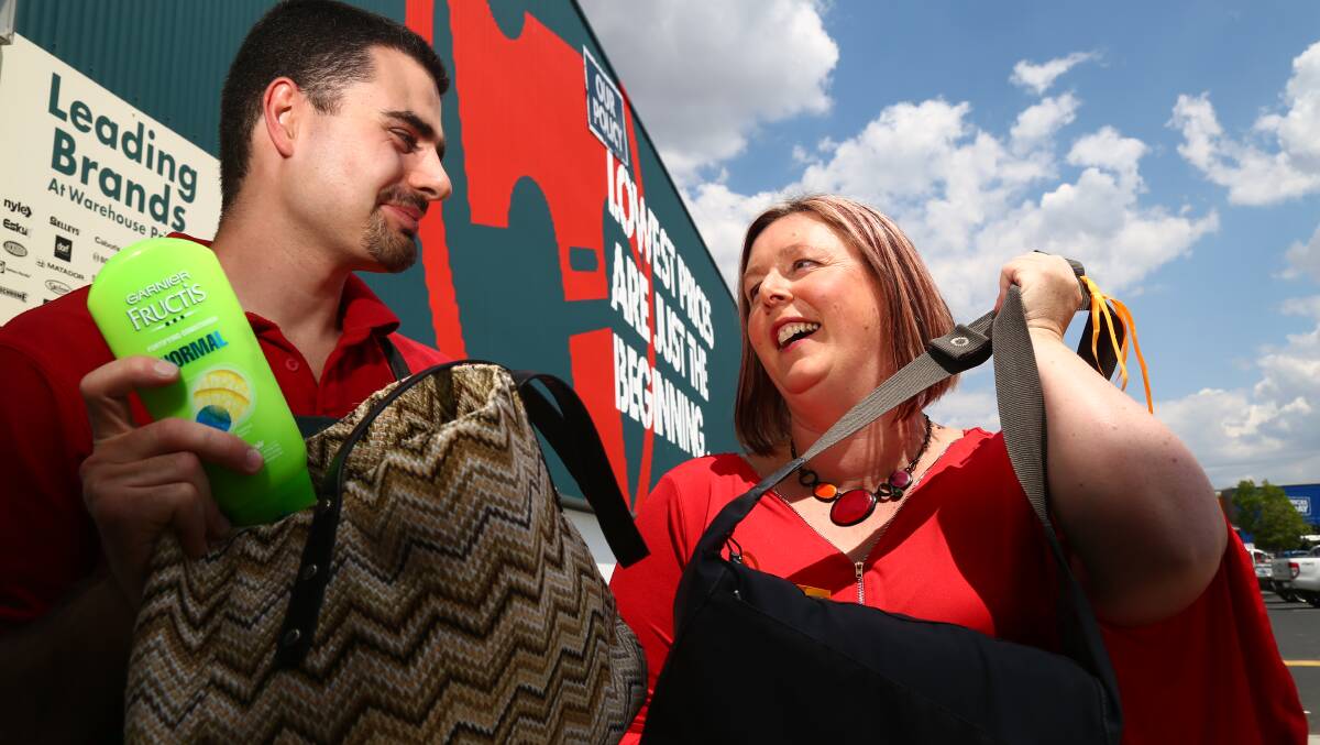 SHARING THE DIGNITY: Bunnings' Ryan Dick and Helen Daunt promoting "Share the Dignity". Bunnings is a national drop off point for donations for the charity.