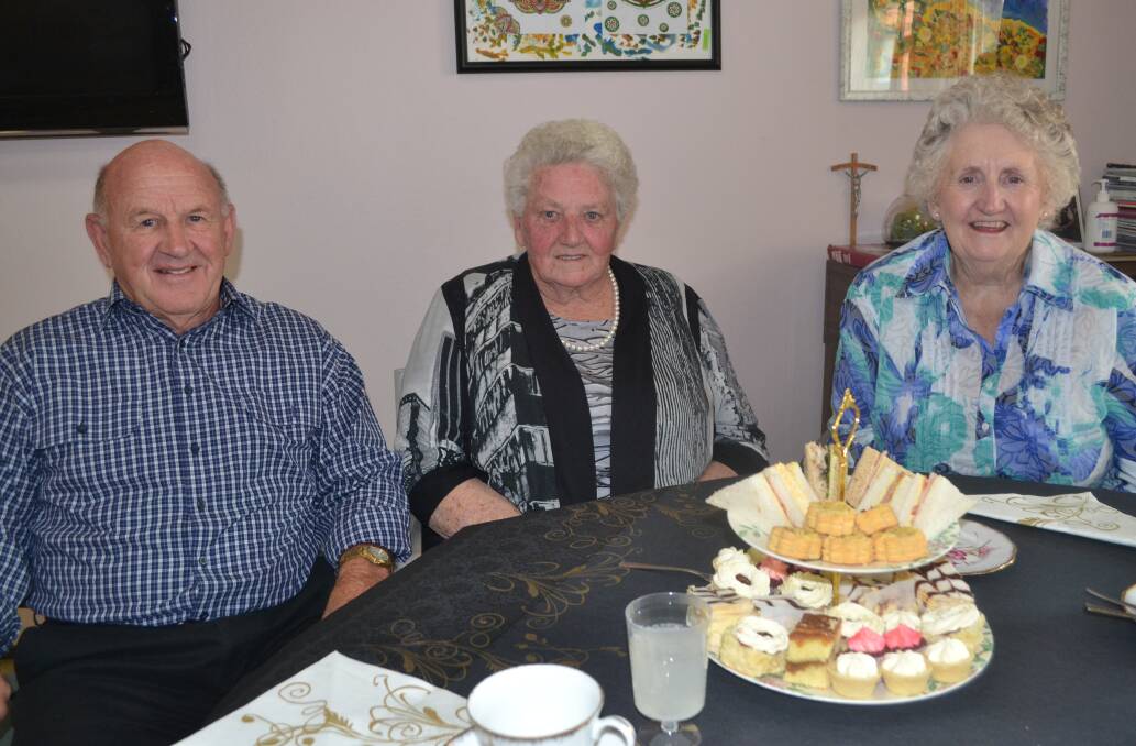 AT ST CATHERINE'S: Enjoying the finery of the high tea are Graeme McAlister, Catherine Miller and Beverley McAlister.