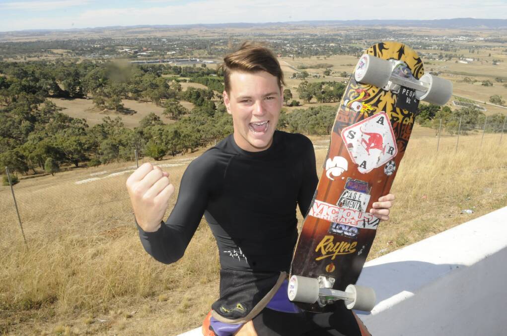NAILED IT: Bathurst's Mitch Thompson celebrates his third place finish in the open skateboard at Sunday's International Downhill Federation World Cup event at Mount Panorama. Photo: CHRIS SEABROOK