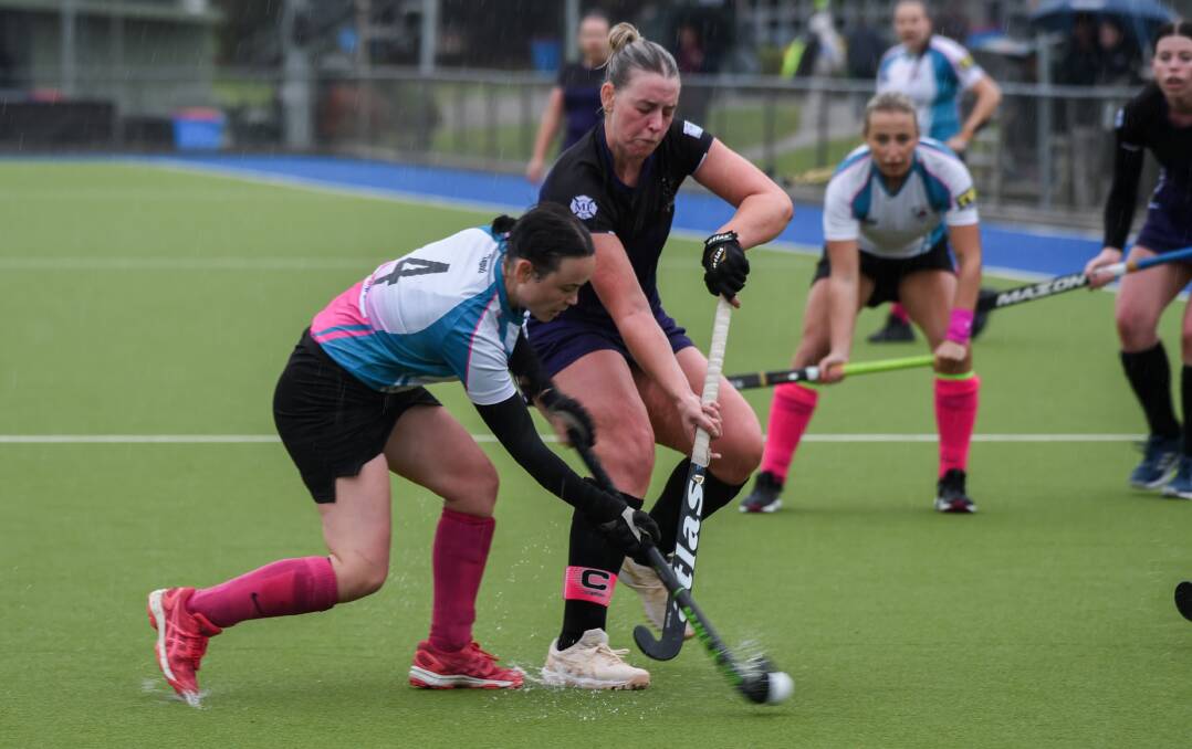 Erin Cobcroft (Bathurst City) and Millie Leard (Lithgow Panthers) fight for possession. Picture by James Arrow.