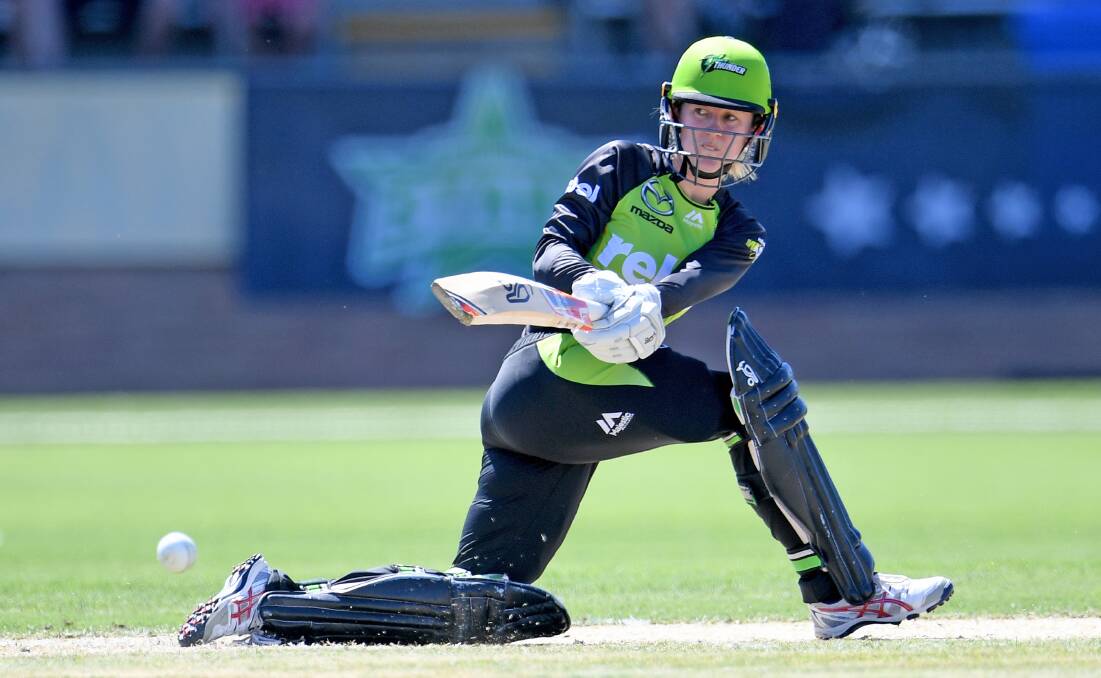 EASY WIN: Sydney Thunder's Rachael Haynes hits a successful sweep on her way to 54 runs in her side's win over the Melbourne Stars. Photo: AAP