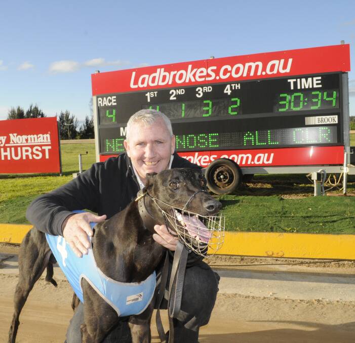 QUICK BLOKE: Owner and trainer Steve Jones with Local Bloke after his win in the Buck Fever @ Stud Stakes (520 metres) at Kennerson Park on Monday. Photo: CHRIS SEABROOK 091916cdogs1a