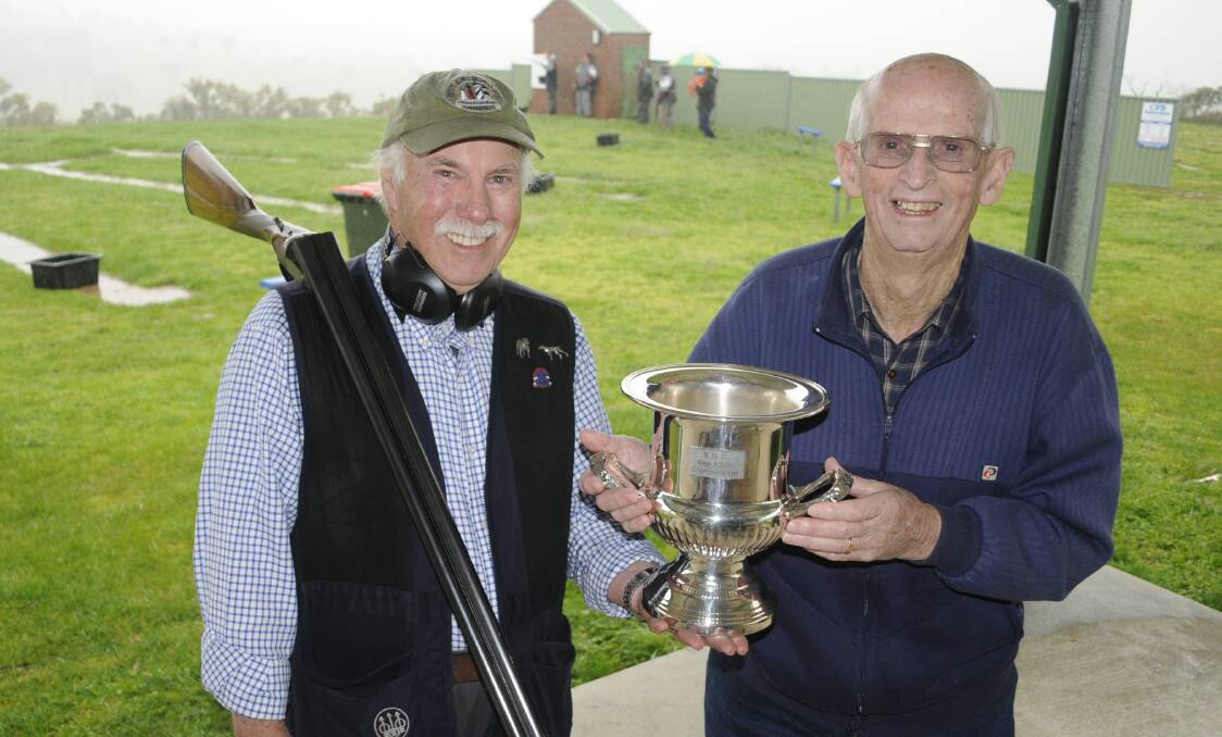 VICTORY: Side x Side Championships winner John Newton with Bathurst Rifle Club president Les Aberley. Photo: CHRIS SEABROOK