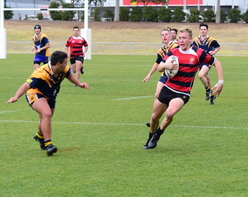 HARD TO CONTAIN: Luke Gale was an unstoppable force in the win over Bathurst High School. Gale picked up a hat-trick in the 26-18 win. Photo: PAIGE WILLIAMS