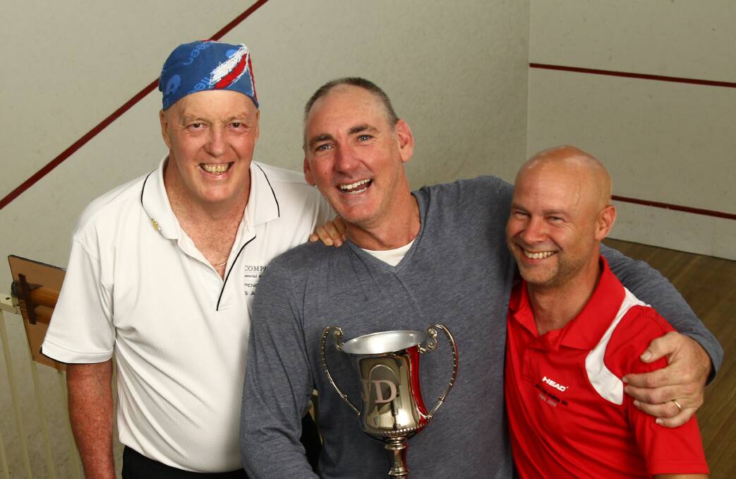 ALL SMILES: Tournament organiser Dave Fuller with winner Jeff Bond and runner-up Howie Johns. Photo: PHIL BLATCH