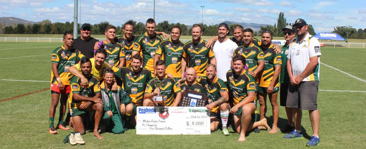WINNERS: The Macquarie Scorpions received the Darryl 'Radar' Meers trophy from the Meers family at the end of two hard days of shortened-format rugby league. Photo: ISAAC MCINTYRE