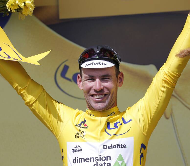 JOYOUS: Bathurst cyclist Mark Renshaw played a pivotal role in helping Mark Cavendish (pictured) to his first ever Tour de France yellow jersey in Sunday morning's opening stage. Photo: AP/CHRISTOPHE ENA