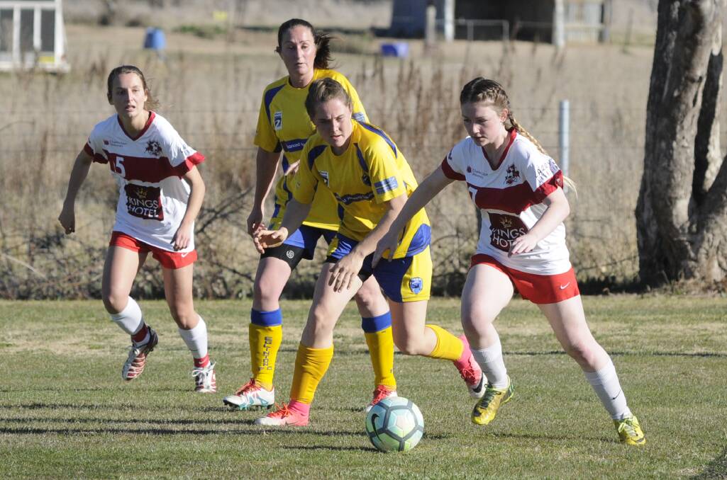 THAT'S MINE: CSU's Paula Mitchell (right) and Eglinton FC's Nadine McAllister fight for possession during Sunday's Bathurst District Football women's Premier League preliminary final. Photo: CHRIS SEABROOK