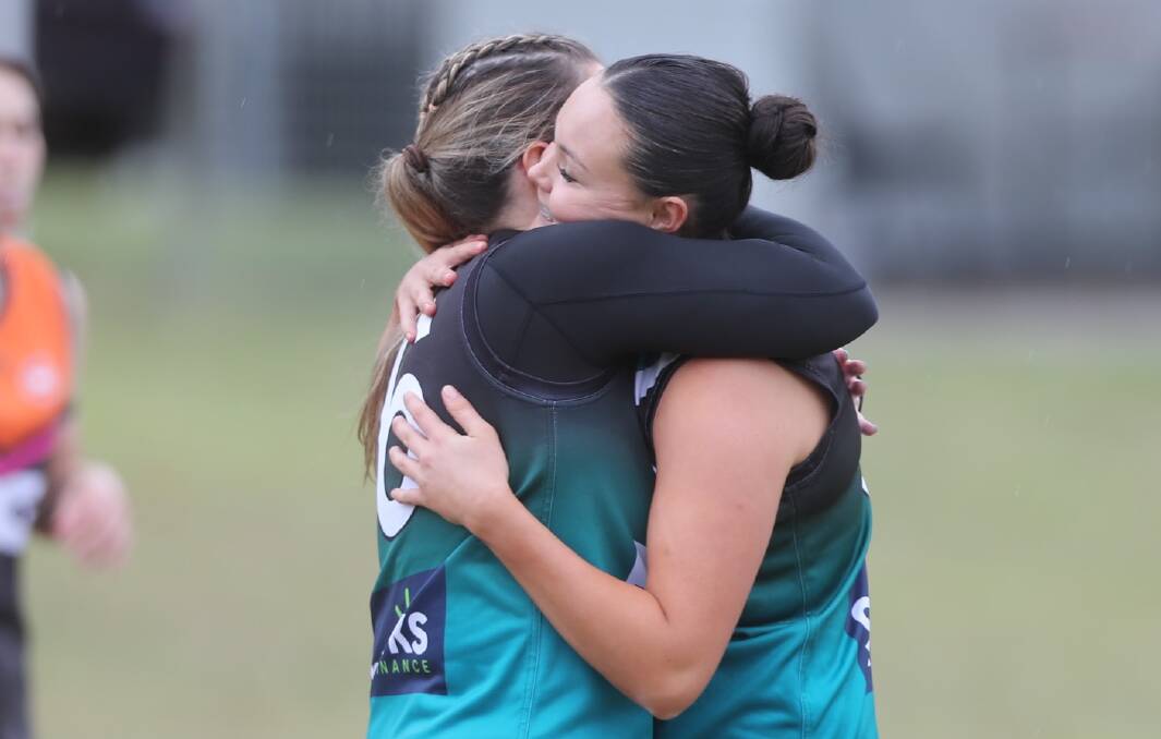 Angela Evans and Callee Black celebrate a goal during the Bushrangers' win over the Giants. Picture by Phil Blatch.
