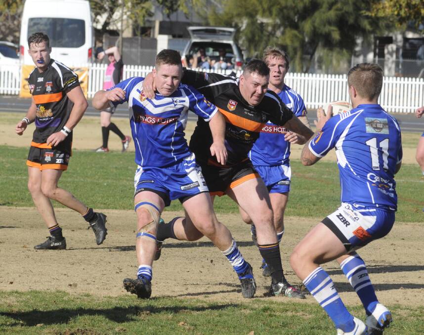BEATEN: McCoy White gets the ball away for St Pat's in their match against Lithgow Workies on Sunday. Photo: CHRIS SEABROOK