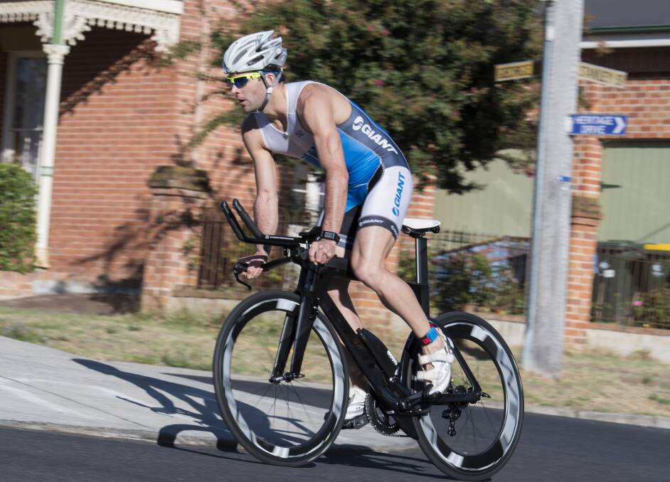 IN THE LEAD: Nick North completes his bike leg in Sunday's Carroll-Scott Memorial, on his way to a fifth successive win in the King Cain Bathurst Wallabies Triathlon Club's annual event. Photo: ALEXANDER GRANT