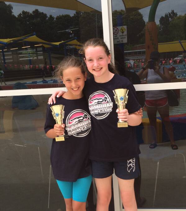 AT THE TOP: TiTANIUM Swim Club's Tahlia O'Connell (9 years) and Zara Grout (13 years) finished as age champions on the weekend.