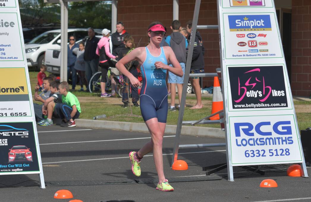 CROSSING THE LINE: Emily Watts takes out the women's long course race in Sunday's opening round of the King Cain Bathurst Wallabies Triathlon Club series.