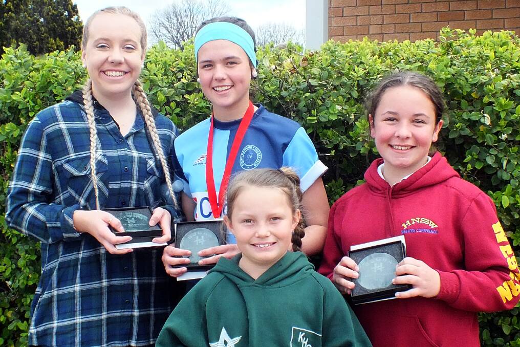 ALL SMILES: Junior girls best and fairest winners. Back: Ivy Moore (opens), Emily Thomas (15s) and Ashley Willott (13s). Front: Isabelle Murray (11s).