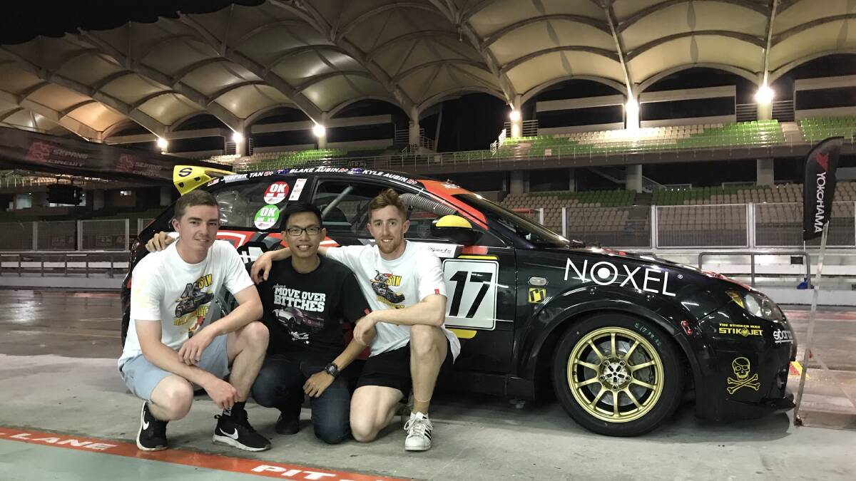 LONG BATTLE: Kyle Aubin, Jesper Tan (team manager) and Blake Aubin came close to a podium finish at the Sepang 1000km on Saturday. The team were in fourth when a gearbox failure ended their race. Photo: SUPPLIED