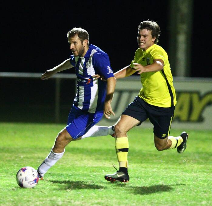 IN PURSUIT: Western NSW Mariners FC's Jaiden Culbert chases down a Gladesville Ryde Magic FC opponent in Saturday night's match at Proctor Park. Photo: PHIL BLATCH