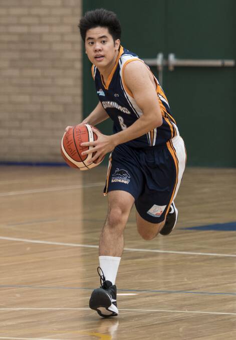 ROUGH GAME: Bathurst Goldminers' Victor Chua was one of nine players fouled out of Saturday's match against the Moss Vale Magic. Goldminers went down by five to the Magic, who remain undefeated. Photo: ALEXANDER GRANT