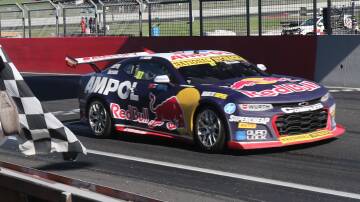 Will Brown takes the chequered flag in Sunday's second race of the Bathurst 500 weekend. Picture by Phil Blatch.