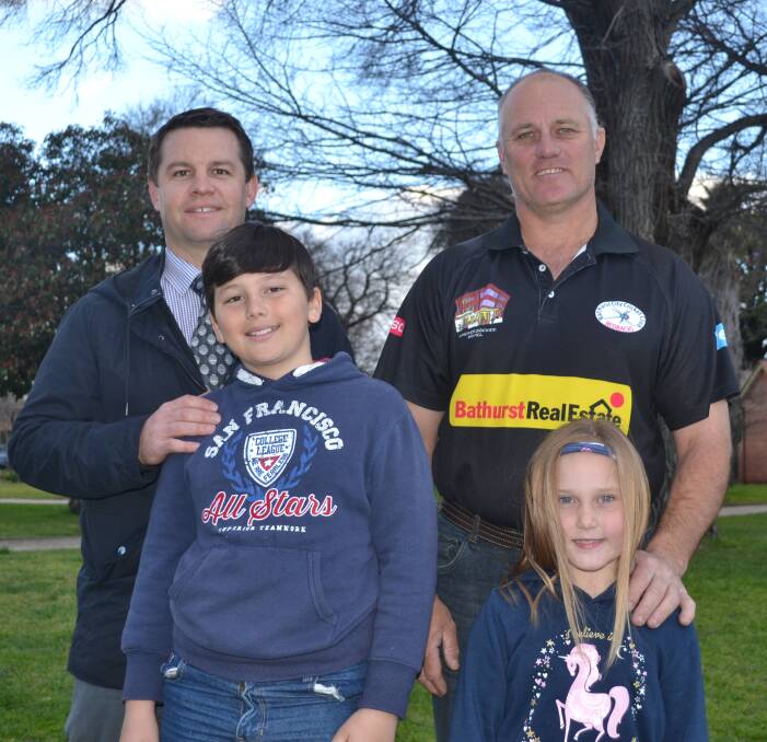 DEBUT SEASON: Trent Hemsworth and Bathurst City president Chris Warry - with children Cooper Warry and Brooke Warry - are looking for new Bathurst City Thunder juniors. Photo: ALEXANDER GRANT
