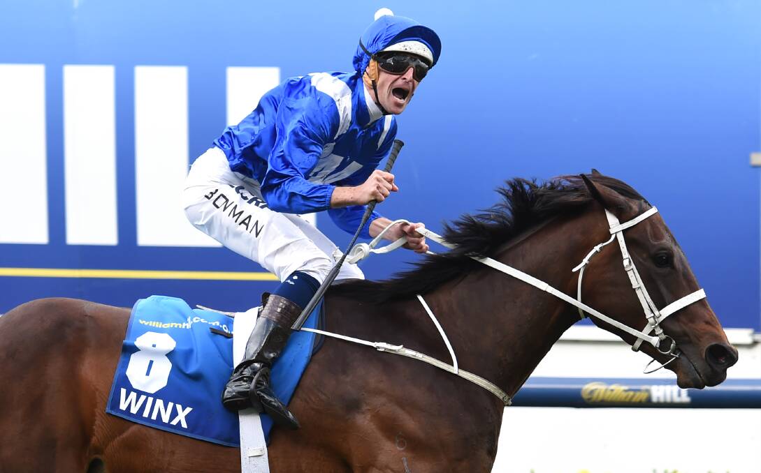 BLITZED THEM: Winx and former Bathurst apprentice Hugh Bowman claimed a remarkable eight-length win in the Cox Plate. Photo: GETTY IMAGES