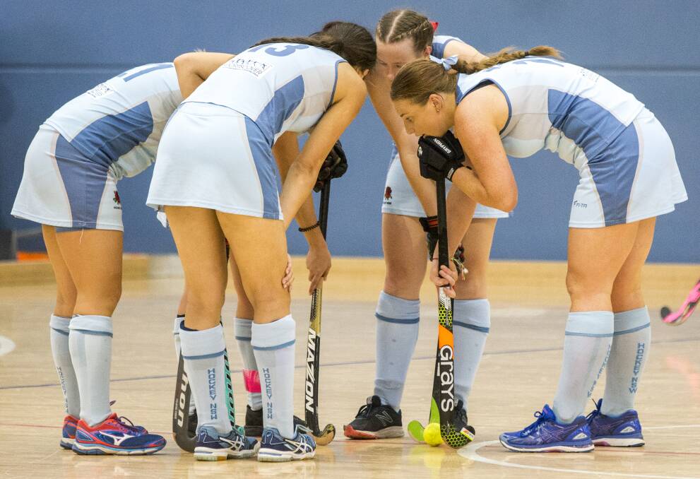 HUDDLE: Sarah Watterson (second from right) and NSW won all of their group matches at the Under 21 Women's Indoor National Championship. Photo: CLICK INFOCUS