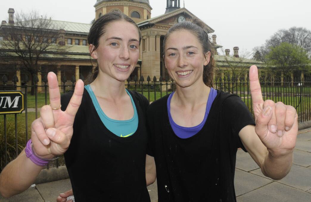 TOP TWO: Twin sisters Holly (second) and Paige (first) Campbell battled for the first woman home honours in Sunday's Edgell Jog. Photo: CHRIS SEABROOK 091816cejog5