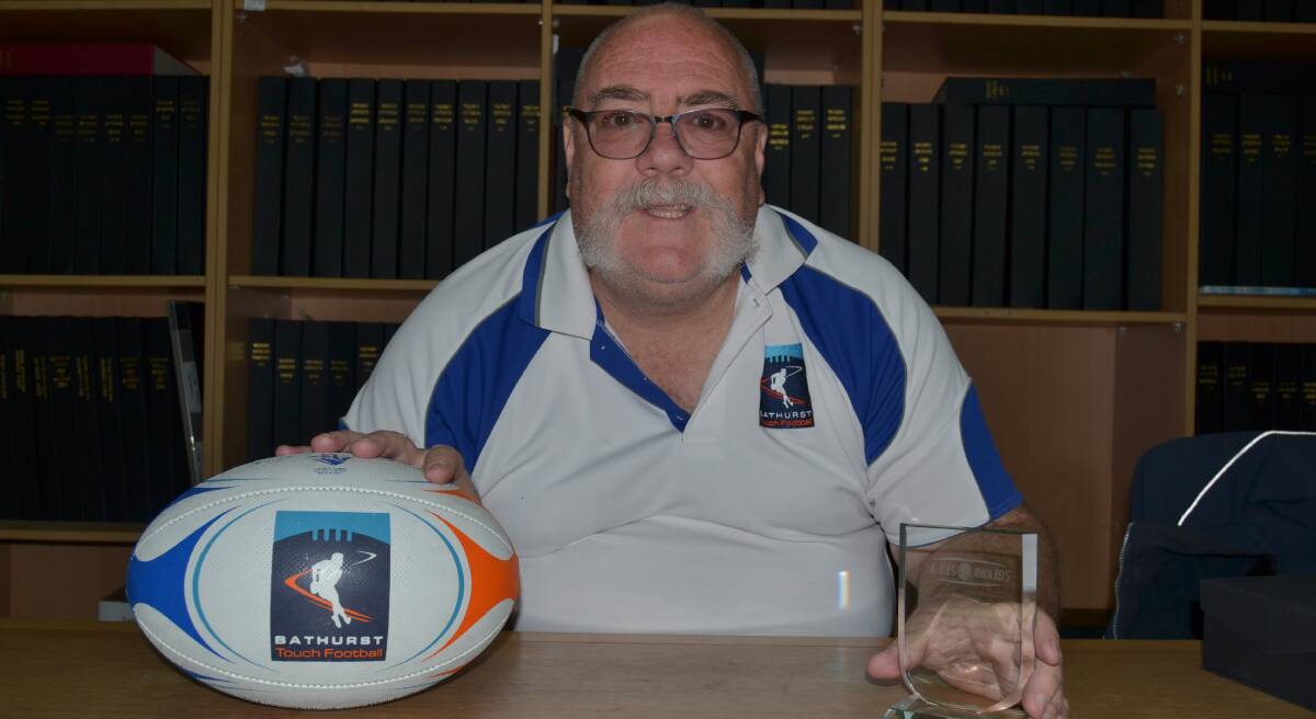 RECOGNITION: Bathurst Touch Football operations manager Tony Lewis with his Sporting Blue prize. Photo: ALEXANDER GRANT