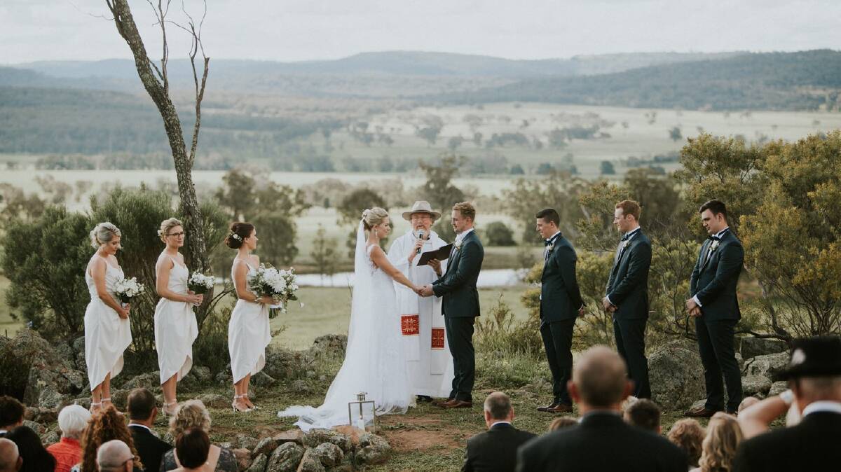 Louise and Paul were married atop the same cliff the bushfire spread down on Saturday. 
