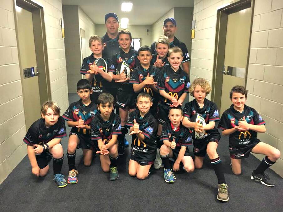 SPECIAL MOMENT: Players from Bathurst Panthers Junior Rugby League Club had a rare chance to run onto the field with the Canterbury Bulldogs on Friday. Photo: SUPPLIED 