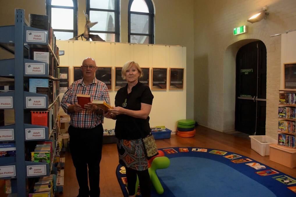 OPEN FOR BUSINESS: Mayor Graeme Hanger and Bathurst Library manager Patou Clerc at the pop-up library. Photo: RACHEL CHAMBERLAIN 122117rcpopl