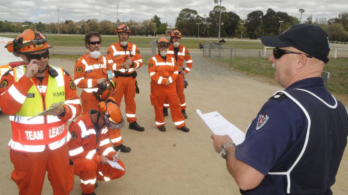 SNAPSHOT: A unit from the Auburn SES was briefed on the scenario they were about to encounter on Sunday. Photo: CHRIS SEABROOK 101517cses2
