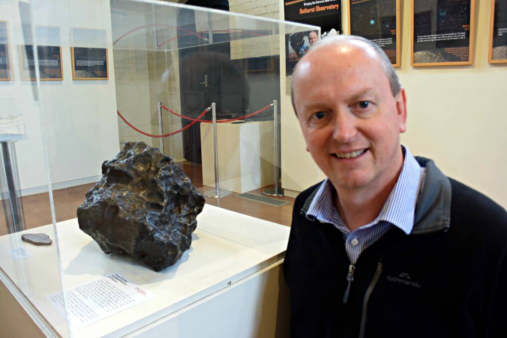 NEW EXHIBITION: Ray Pickard from Bathurst Observatory with one of the pieces from his collection currently on display at the Australian Fossil and Mineral Museum. Photo: RACHEL FERRETT 080317rfspace1