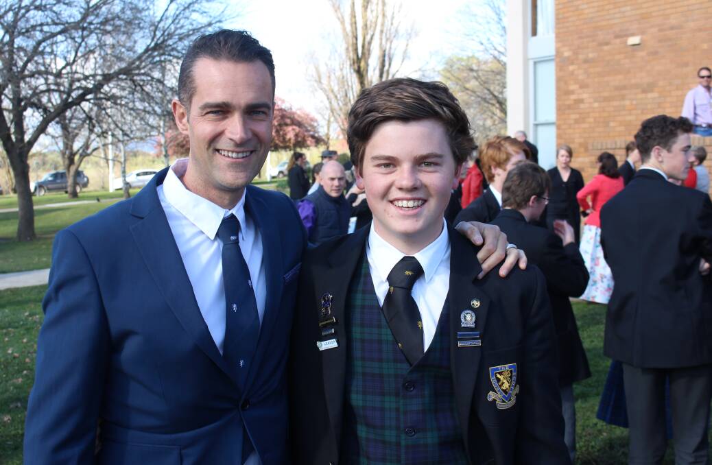 ALL SMILES: Boarding master Duane Bailey with Hamish Andrews, from Rylstone, at The Scots School valedictory assembly. 