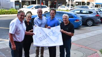 Peter Rogers, business owners Karla McDiarmid and Matt Clifton, mayor Jess Jennings and Graeme Burke standing in Howick Street with drawings for parking. Picture by Rachel Chamberlain