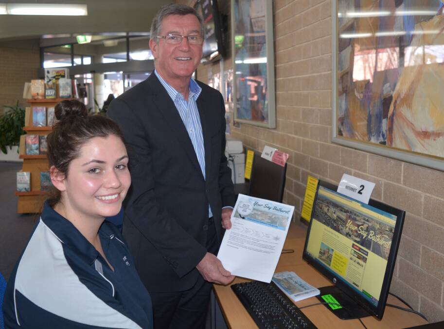 FEEDBACK MADE EASY: Bathurst Library staff member Victoria Murray with Mayor Gary Rush, showing off the new Your Say Bathurst website. Photo: SUPPLIED