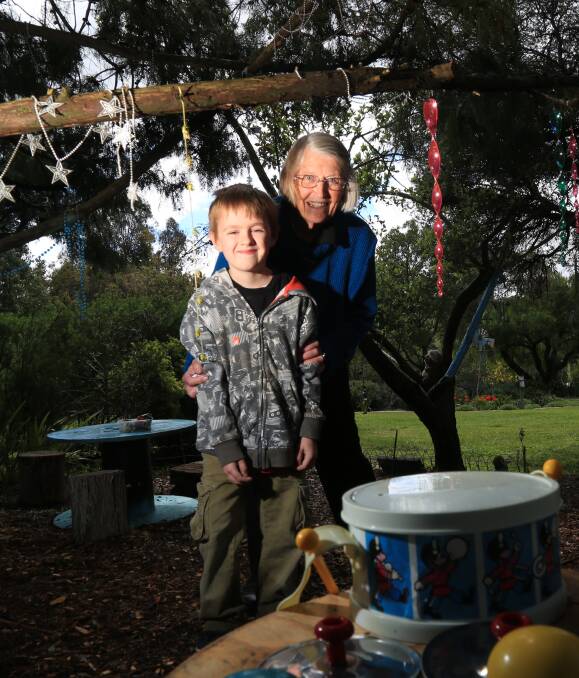 A WEEKEND OUTDOORS: Marcia Bonham was joined by her great nephew Liam Crawford in the kid's garden at 'Bondura' on Sunday when the property was open to the public. Photo: PHIL BLATCH 092516pbbondura1