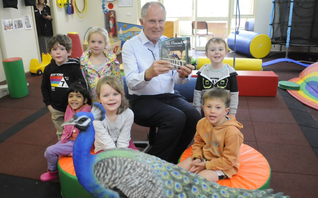 NEW: Dr Noel Thomas with his book and children from Bathurst Early Childhood Intervention Service. Photo: CHRIS SEABROOK 101716cpeacock