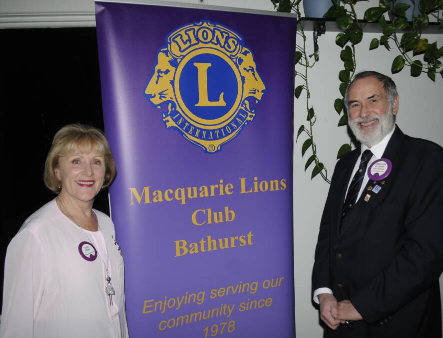 CHANGEOVER: Incoming president Judy Ryan with outgoing president Graham Carter at the Macquarie Lions Club dinner. 072316clions1