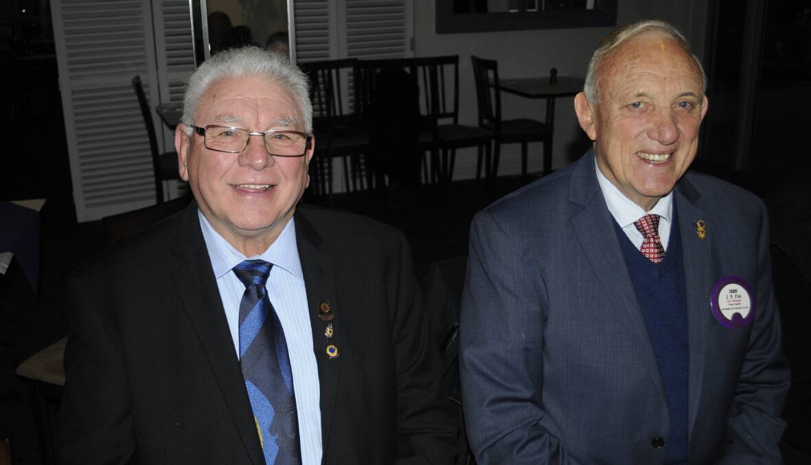 WITH FRIENDS: Gavan Ellis and John Fish enjoyed themselves at the recent changeover dinner for the Macquarie Lions Club. 072316clions7