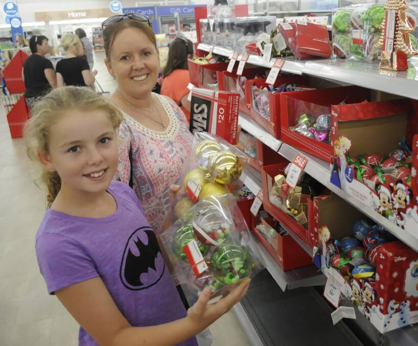 SHOPPING SPREE: Abby and her mum Tracy Stevens were among the customers checking out the post-Christmas bargains to be had at Big W Bathurst Tuesday afternoon. Photo: CHRIS SEABROOK 122716cbigw1