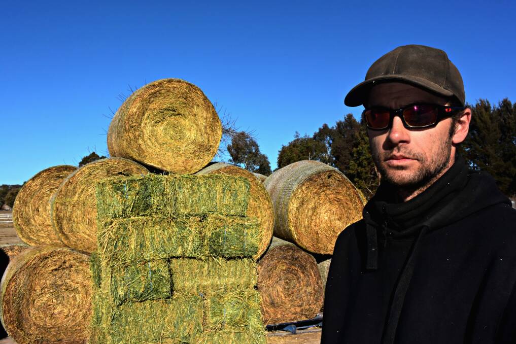 IN DEMAND: Perthville Feed and Rural owner Christian Ilieff has been selling a lot of hay throughout July to Bathurst farmers struggling with the lack of rain during winter. Photo: RACHEL FERRETT 072817rfhay