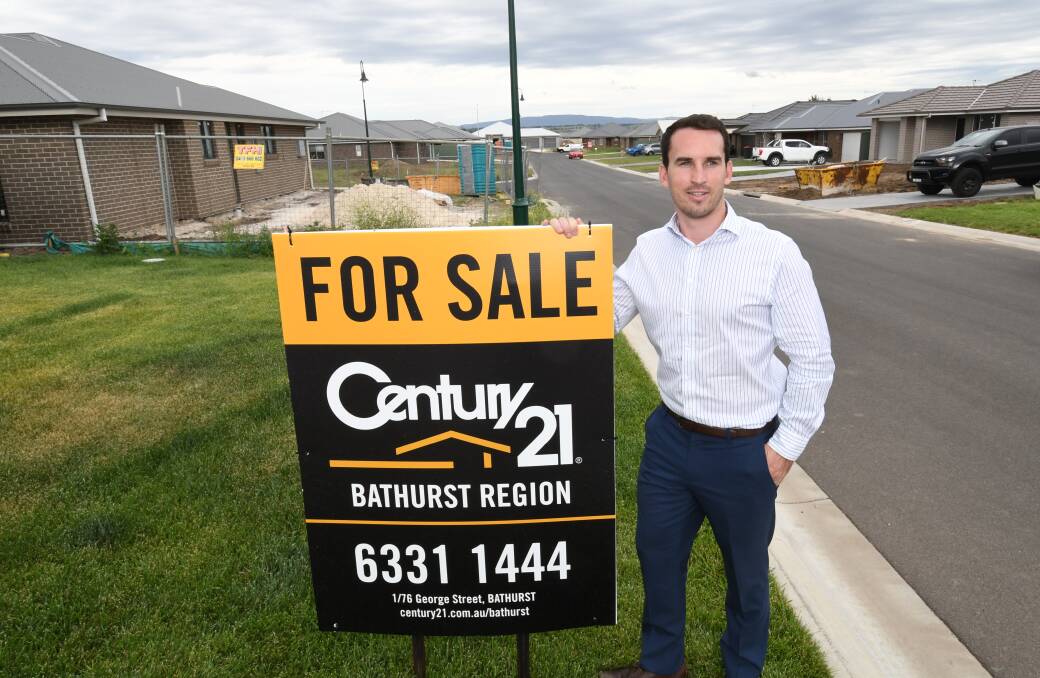NOT ALL BAD: Real estate agent Tom Clyburn from Century 21 Bathurst, which is still seeing strong inquiry despite the market slowing down in the second half of 2017. Photo: CHRIS SEABROOK 122017creal1