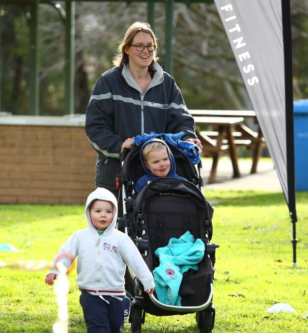 AN EVENT FOR ALL: April, Judah and Adam McMillan were among the many individuals and families who ventured out to Bicentennial Park early Saturday morning for the launch of parkrun in Bathurst. Photo: PHIL BLATCH 073016pbpark3